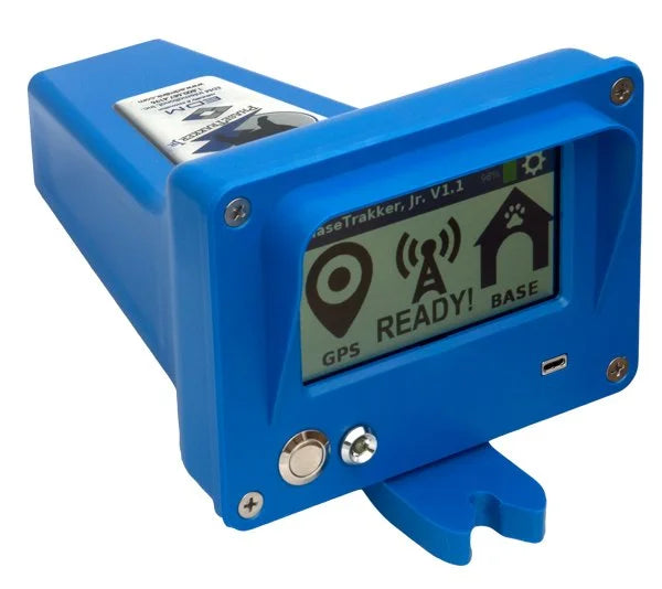 A blue electronic tracking device labeled 'BaseTrakker, Jr. V1.
