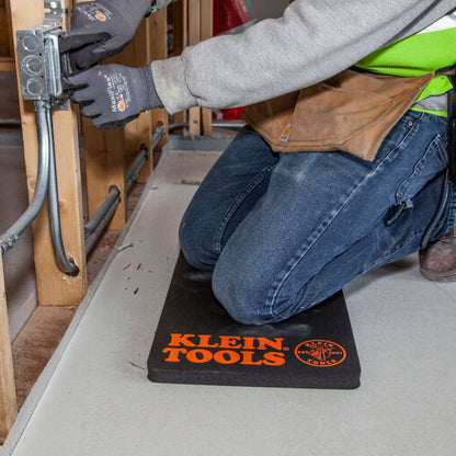 Klein Tools - Tradesman Pro™ Standard Kneeling Pad Lifestyle shot of worker kneeling on pad