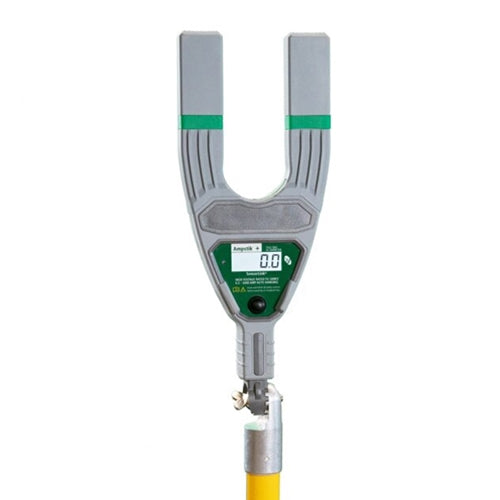 Handheld digital grounding and bonding tester with a gray U-shaped sensor head, green accent bands, and an integrated LCD display showing a reading of “0.0.” The device is mounted on the end of a yellow insulated pole and is shown against a light gray background. Designed for testing electrical grounding continuity and measuring resistance.